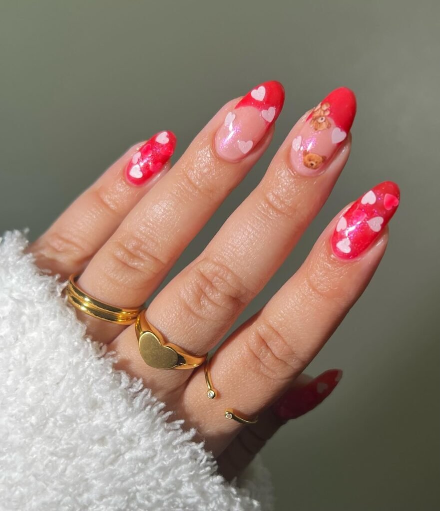 Classic Valentine’s Day nails featuring red and pink heart designs with a glossy finish for a romantic touch