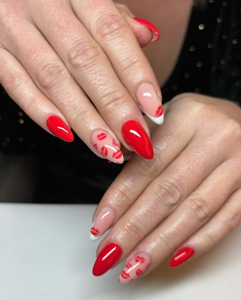 Classic Valentine’s Day nails featuring red and pink heart designs with a glossy finish for a romantic touch