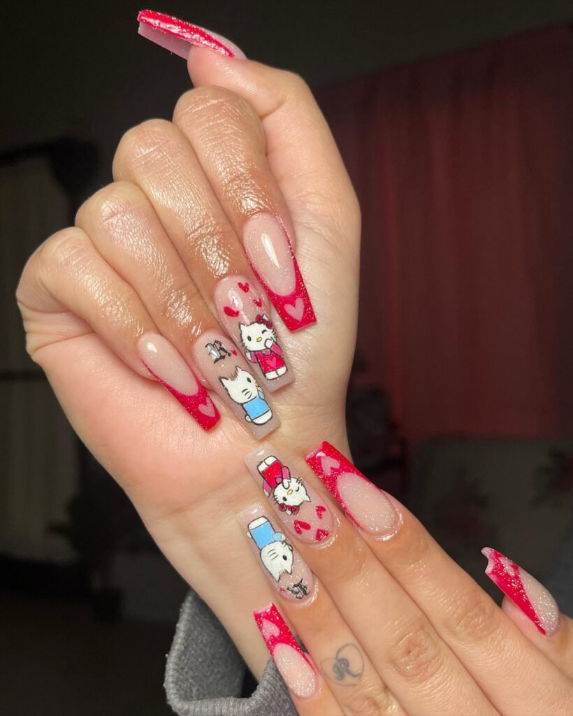 Classic Valentine’s Day nails featuring red and pink heart designs with a glossy finish for a romantic touch