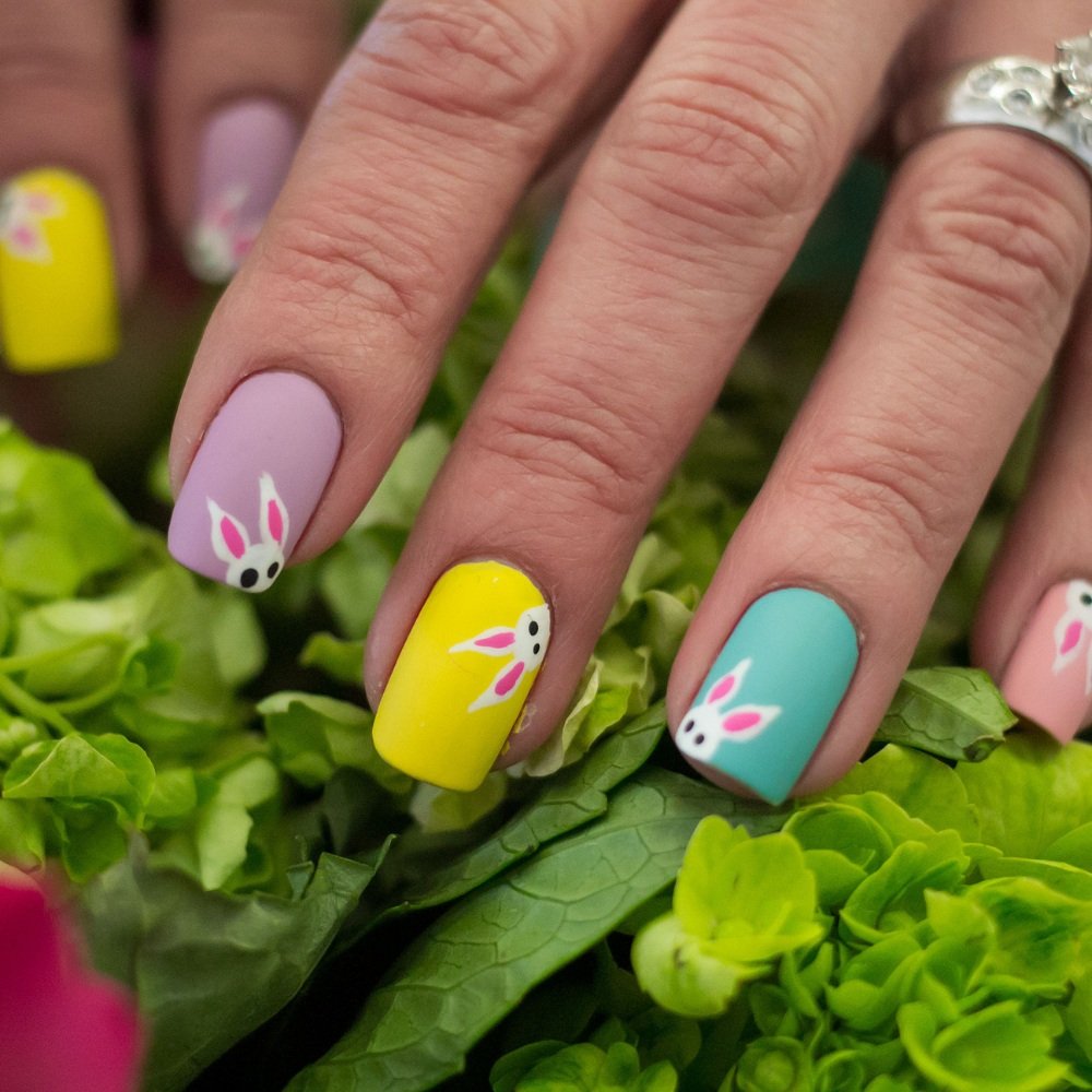 Funny bunny nails with a mix of bubble bath and chrome finishes perfect for Easter or a chic almond-shaped manicure.