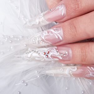 Elegant bridal nails with French manicure and white chrome accents, perfect for weddings.