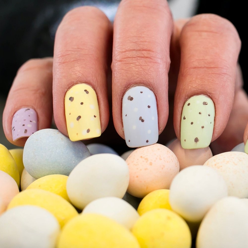 A vibrant collection of easter egg nails showcasing spring nails with playful easter nail designs and colors.
