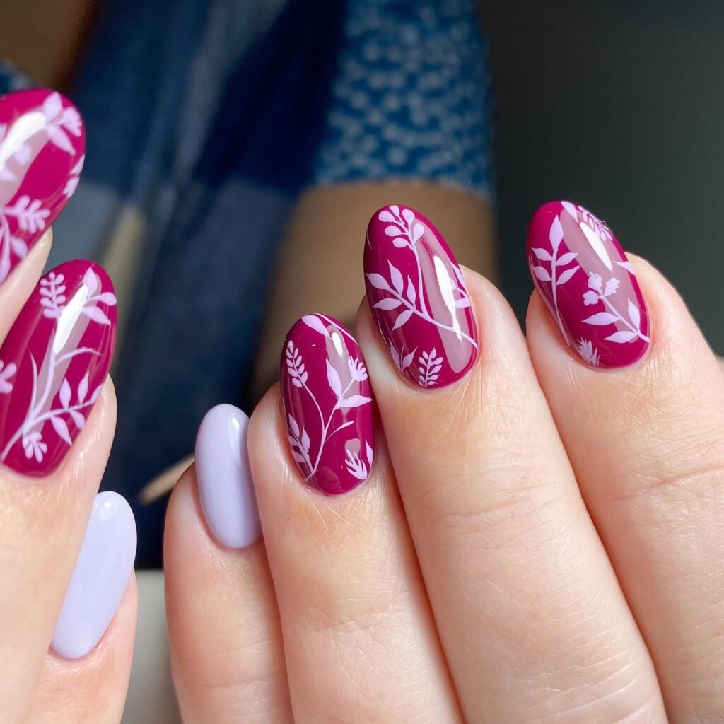 Elegant summer nails with vibrant pink and blue flower designs, featuring acrylic 3D flowers on a glossy white base, perfect for spring and summer fashion.