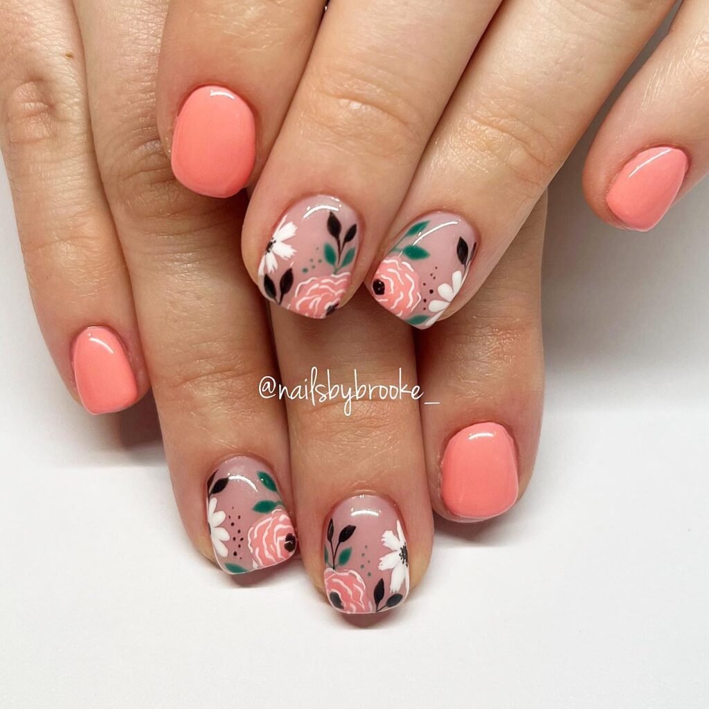 Elegant summer nails with vibrant pink and blue flower designs, featuring acrylic 3D flowers on a glossy white base, perfect for spring and summer fashion.