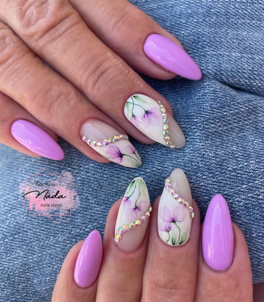 Elegant summer nails with vibrant pink and blue flower designs, featuring acrylic 3D flowers on a glossy white base, perfect for spring and summer fashion.